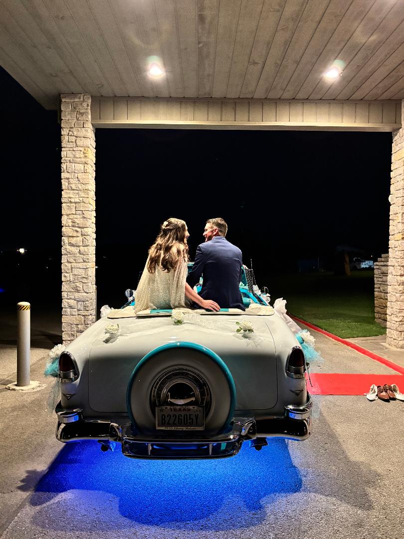 Rear view of Ole' Belle with the newlyweds and blue underbody lights